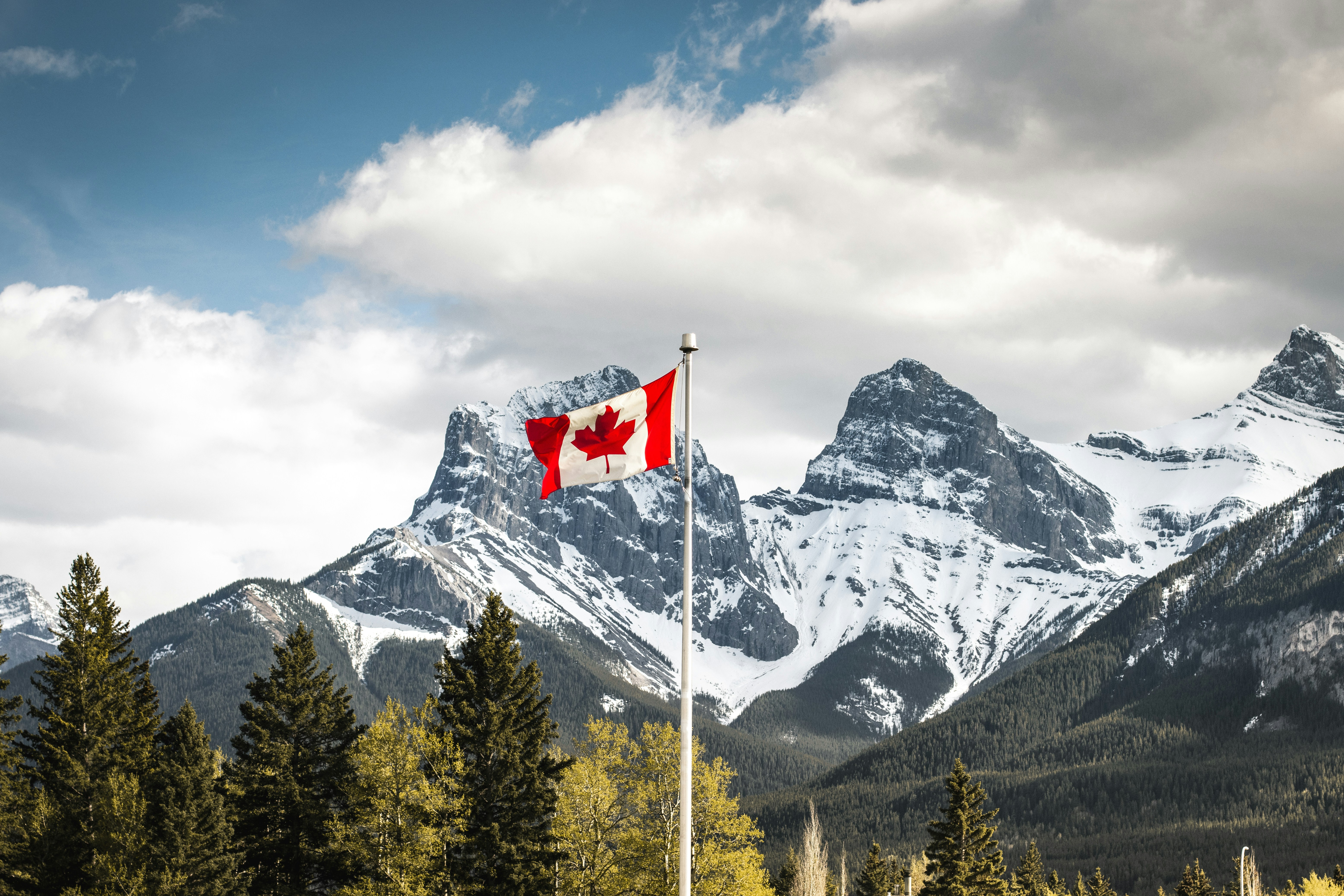 Canadian flag with Rocky Mountains